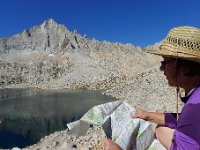 133  Barbara looking at Royce Lake, Feather Peak with a heart snow patch, and the map
