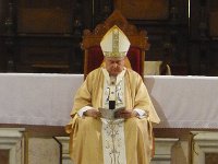 P1010674  Archbishop. Changing hats for different parts of the mass. He has not skipped any meals lately.